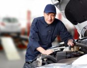 man repairing automatic transmission