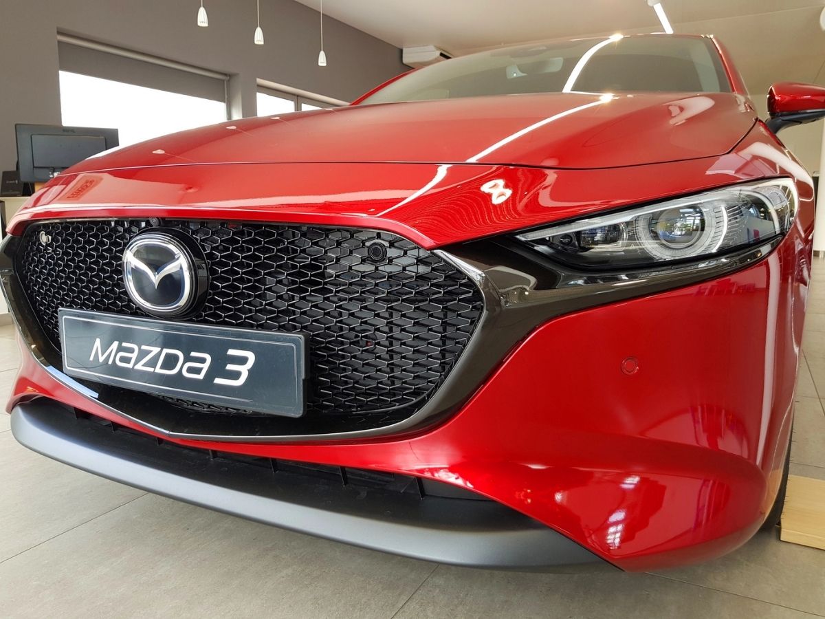 a mazda 3 displayed in a showroom