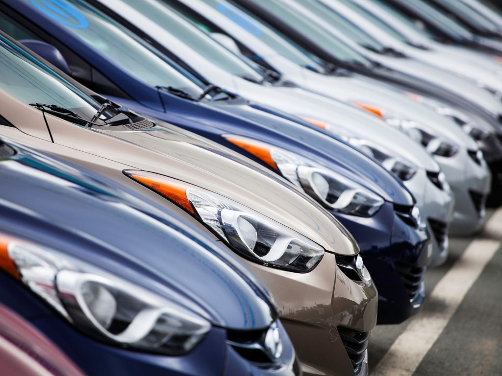 Hyundai vehicles lined up in a dealership showing different models and transmission options